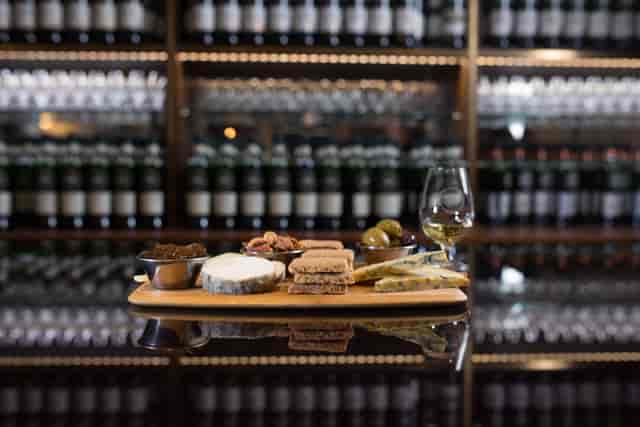 Charcuterie board and whiskey in SMWS Private Room for upscale events.