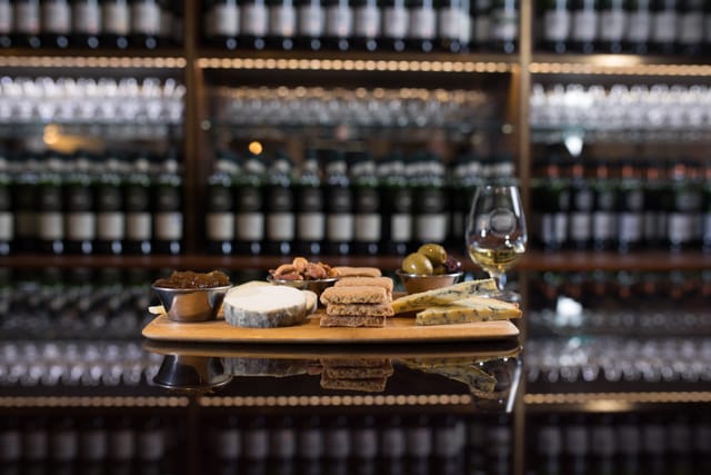 Charcuterie board and whiskey in SMWS Private Room for upscale events.