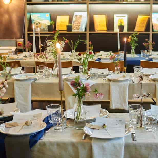 Elegant dining setup at Number 10 London with floral centerpieces for events.
