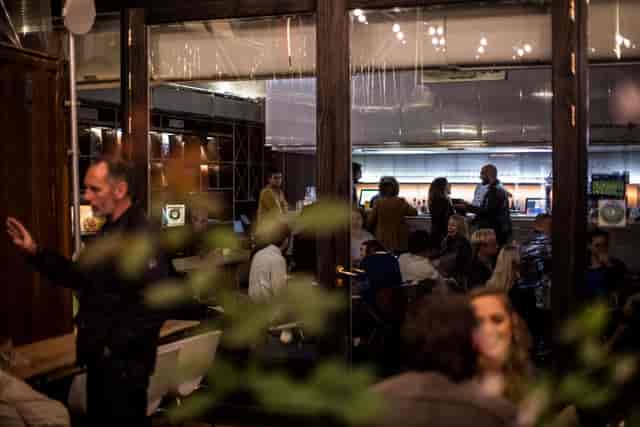 Networking event at Number 10 London, featuring vibrant conversations in a modern venue.