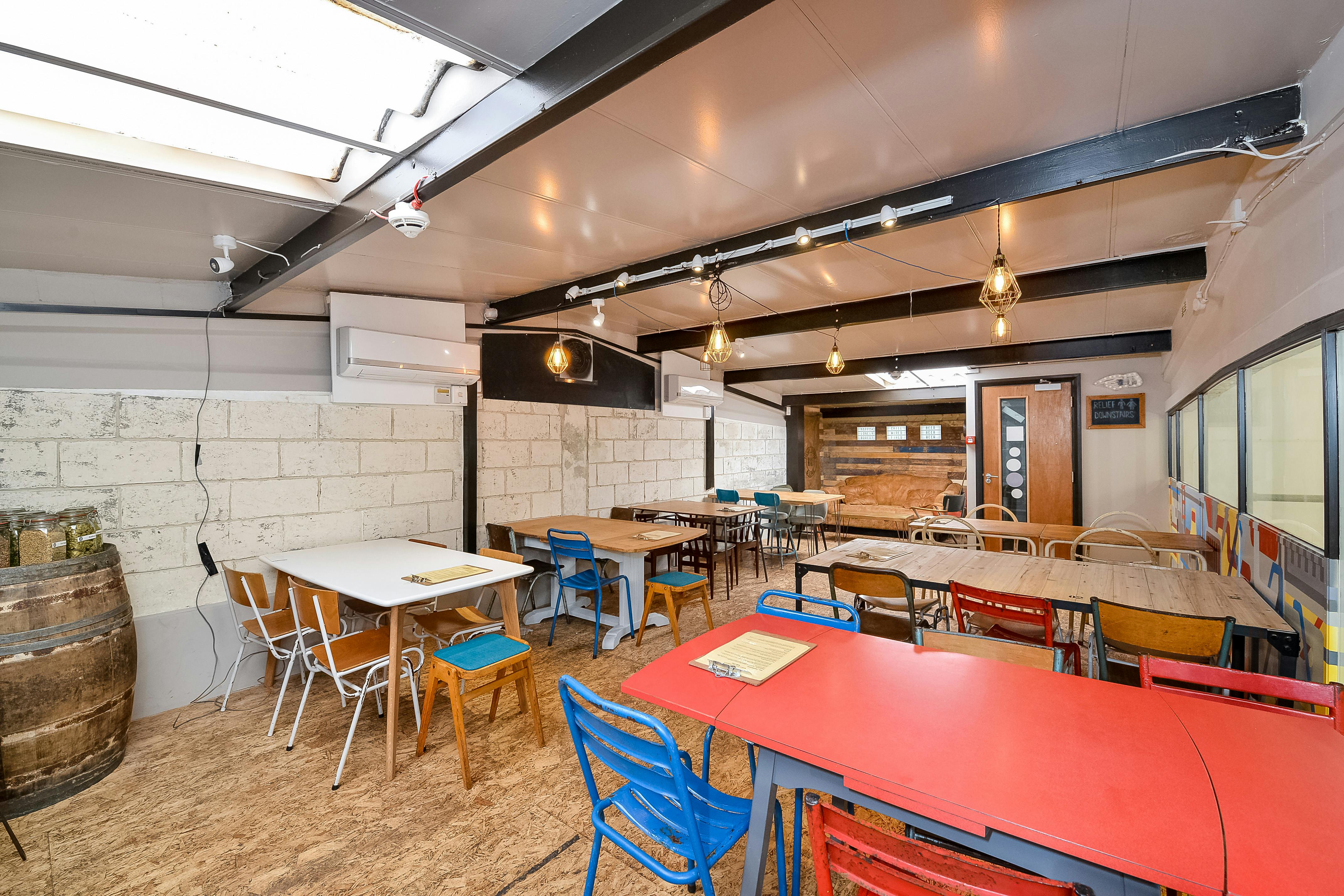 Taproom at Sambrook's Brewery, modern event space with colorful seating for workshops.