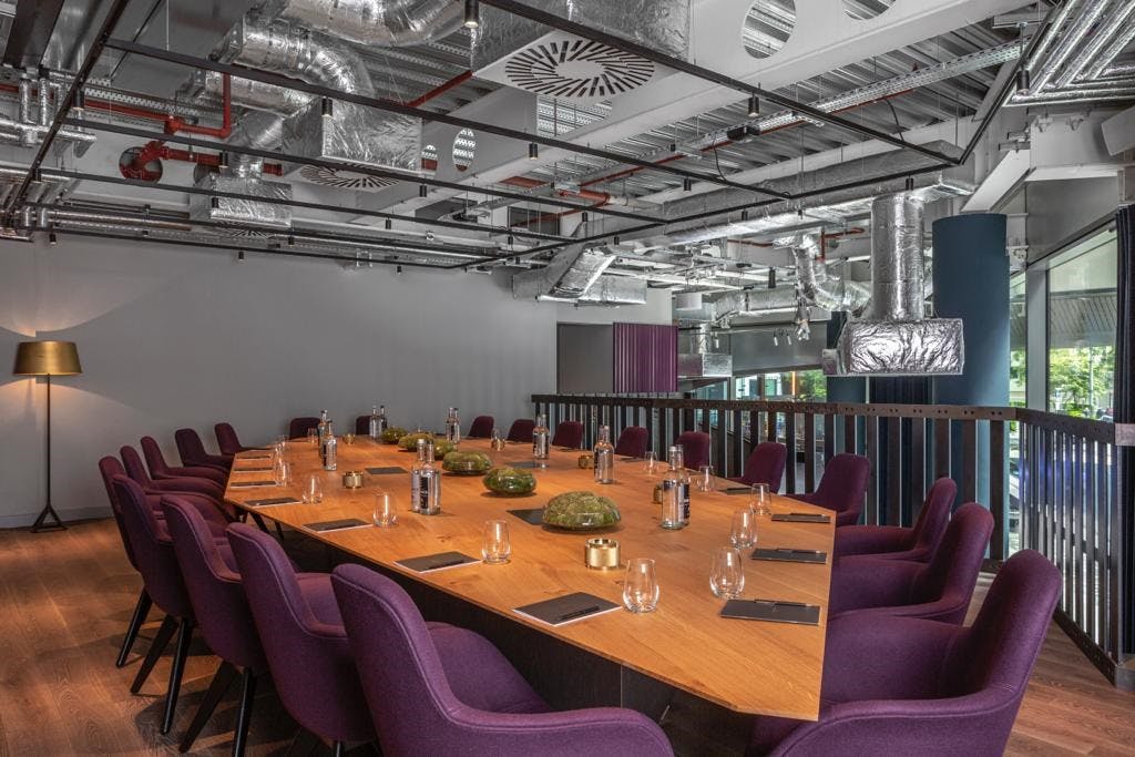 Modern meeting room at Sea Containers Hotel London with plush chairs, ideal for workshops.