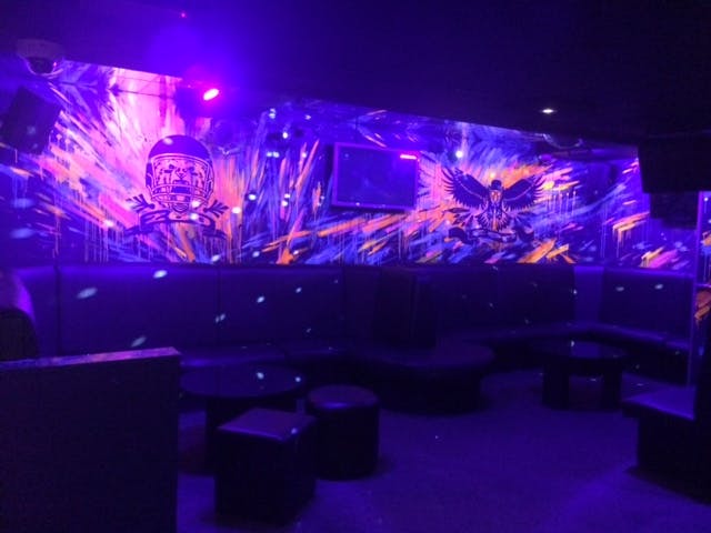 Vibrant Zoo Bar event space with dynamic lighting for lively gatherings and themed parties.