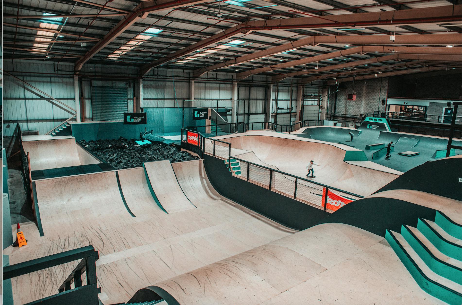 Indoor skatepark with ramps at Graystone Action Sports Academy for events and competitions.