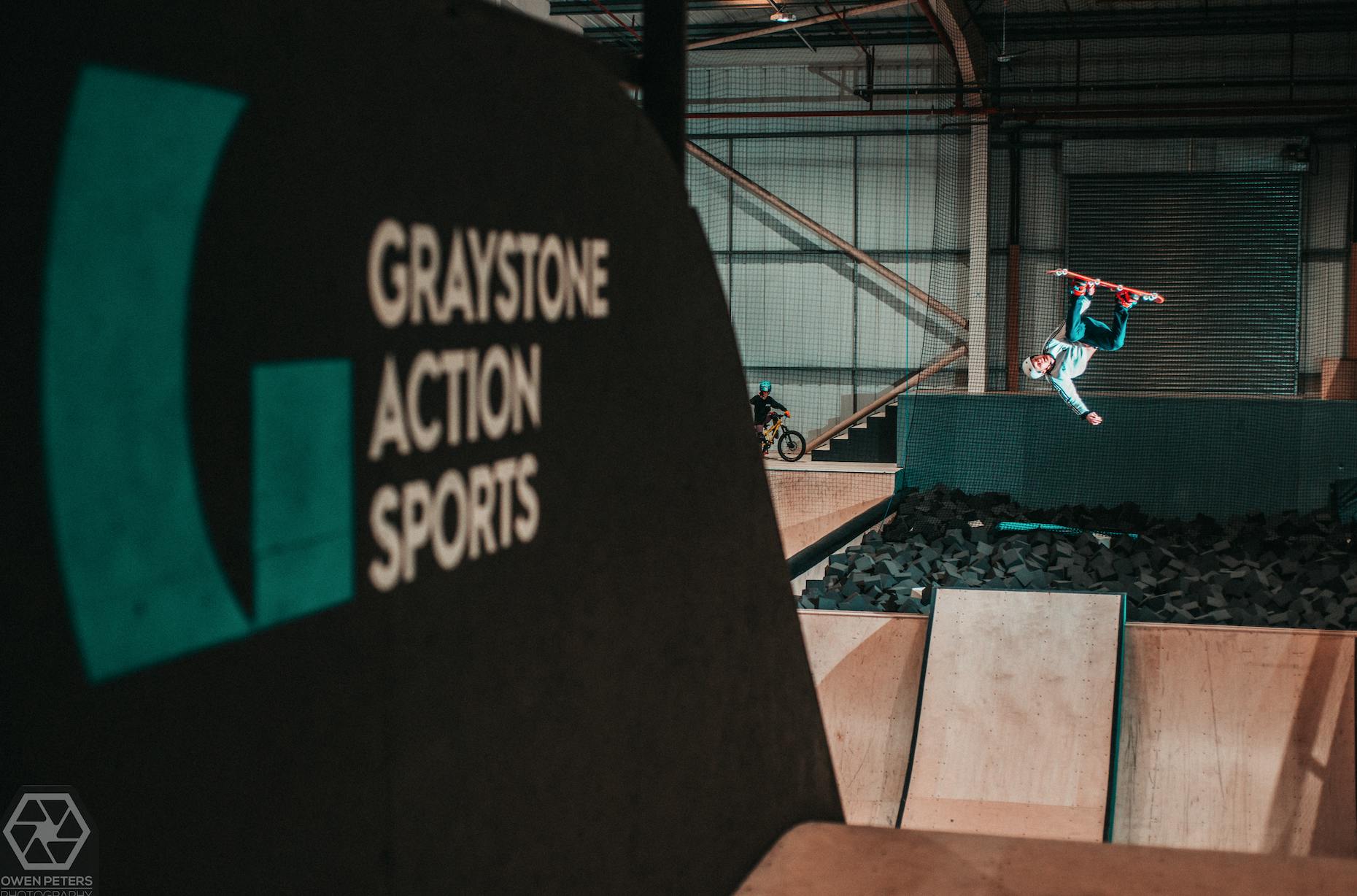 Big Air Ramp at Graystone Academy with skateboarder mid-air, perfect for action sports events.