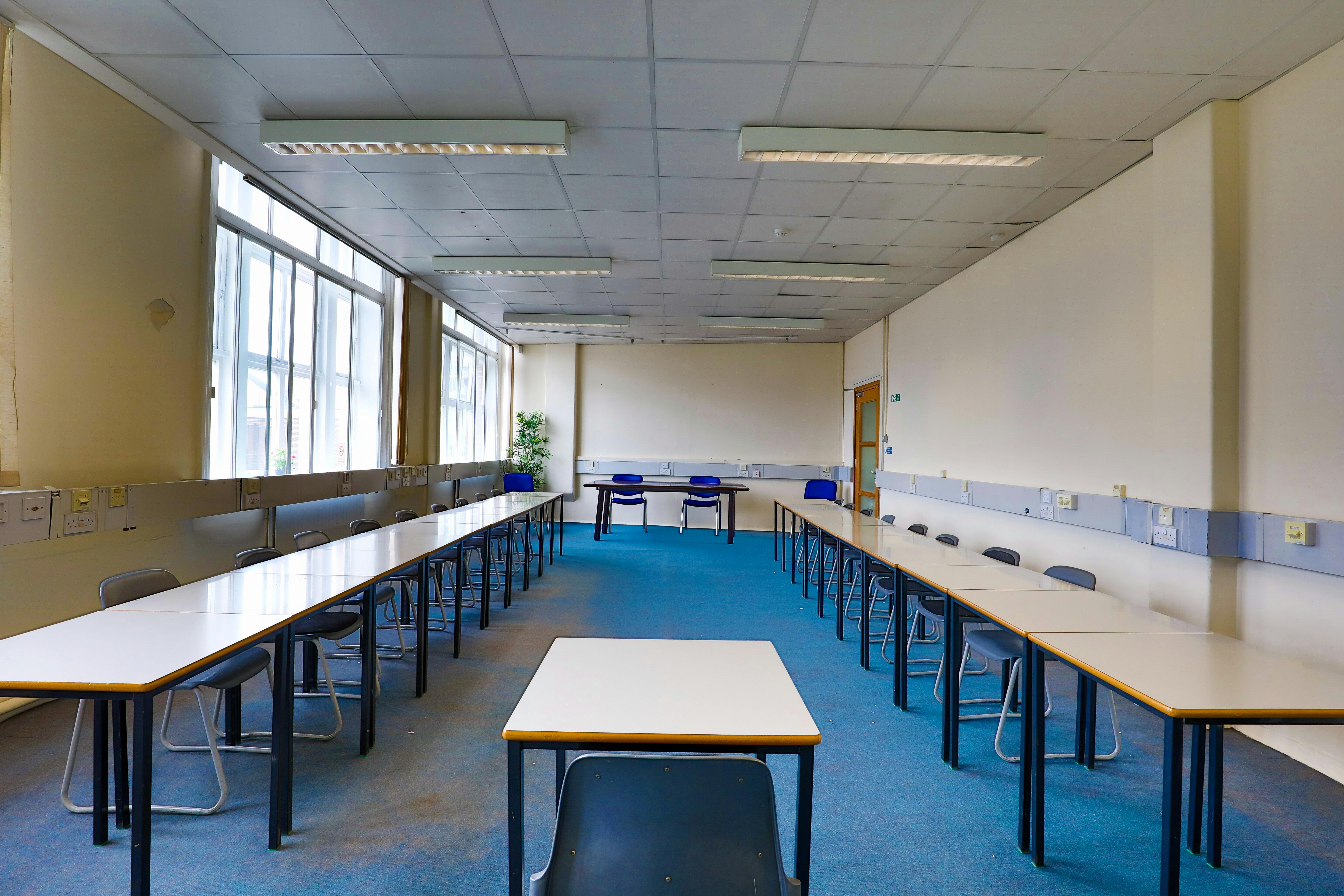 Spacious conference room with U-shaped tables for workshops and seminars at Philip Training Centre.