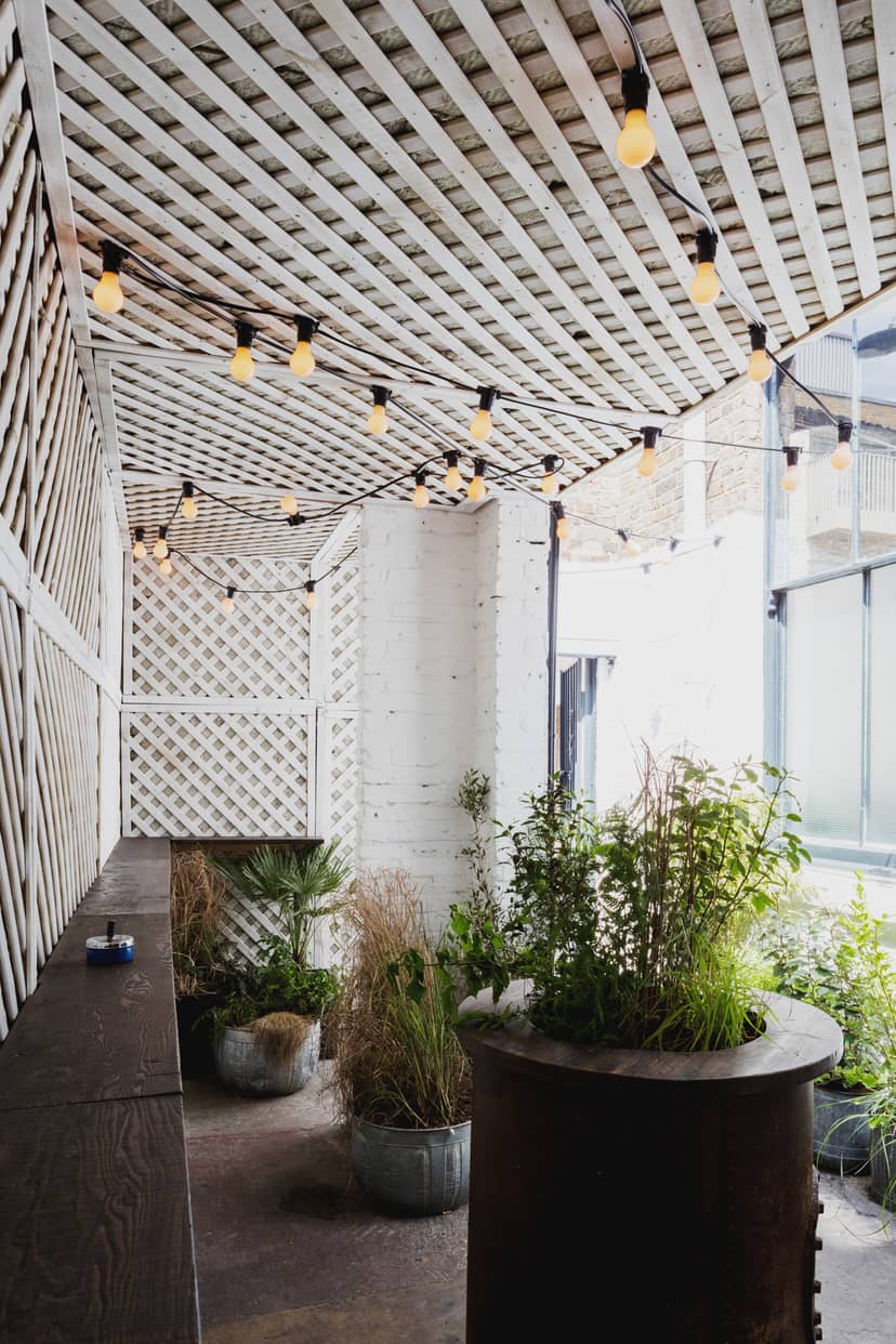 Charming outdoor venue at Martello Hall with string lights for intimate gatherings.