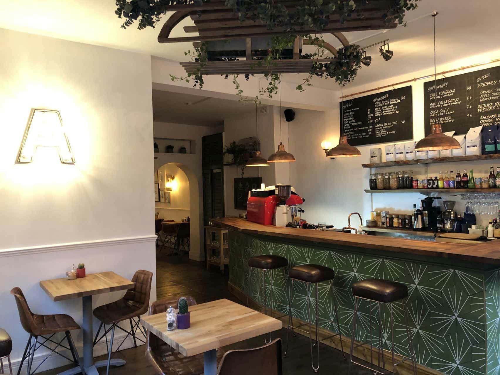 Cozy café venue at Archie's with stylish decor, ideal for informal meetings and events.