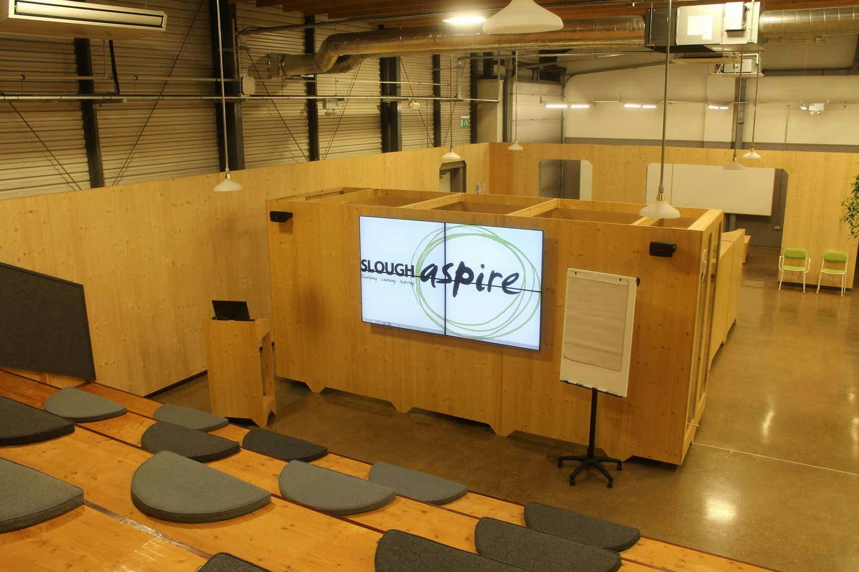 Modern meeting space with tiered seating, ideal for workshops and team meetings.