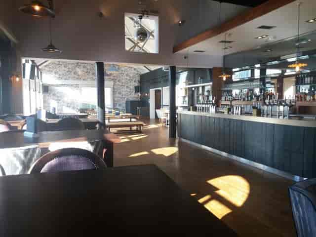 Spacious modern event venue with large windows at Upstairs Bar, Pitcher & Piano York.