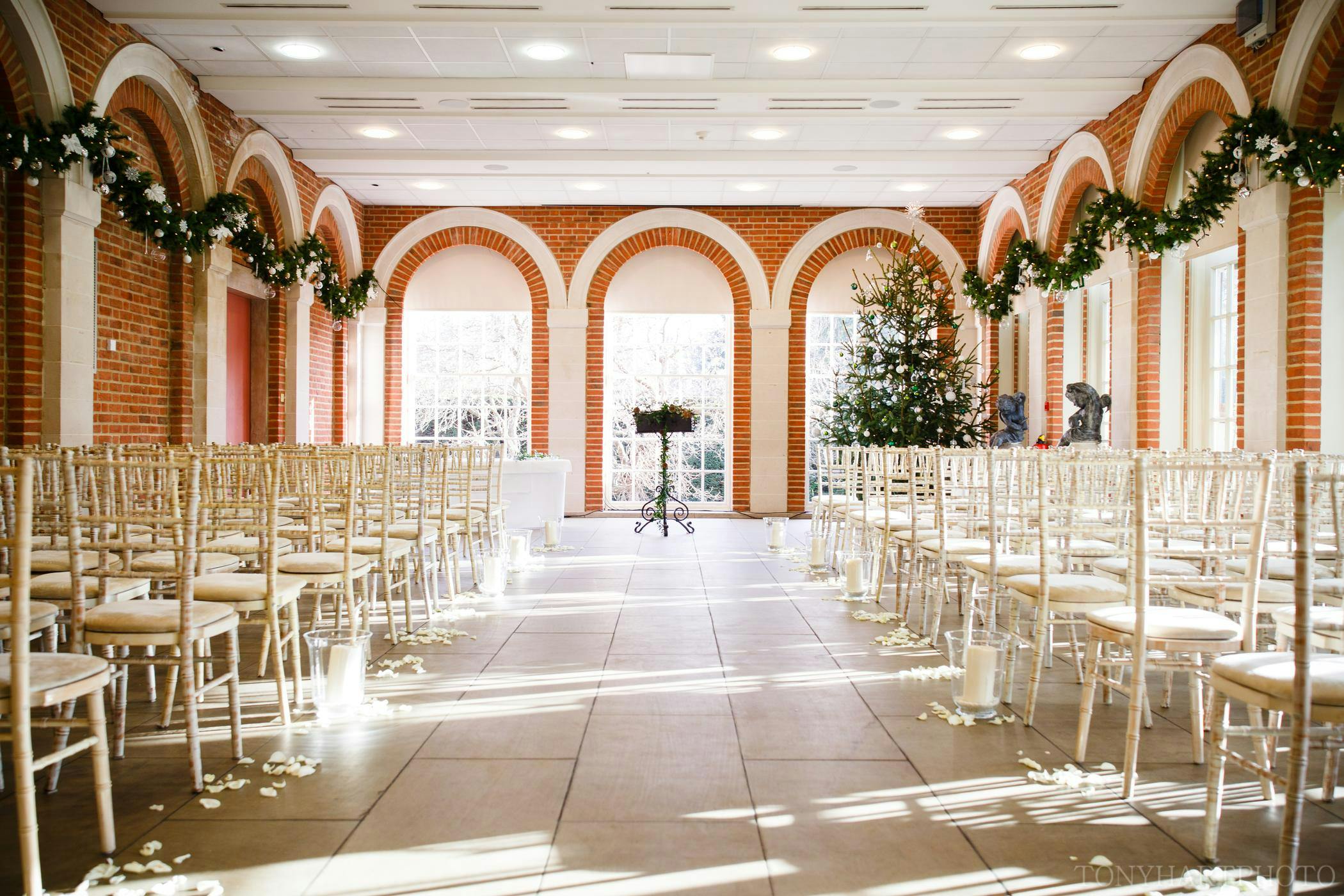 Orangery at Great Fosters with chiavari chairs, ideal for weddings and events.