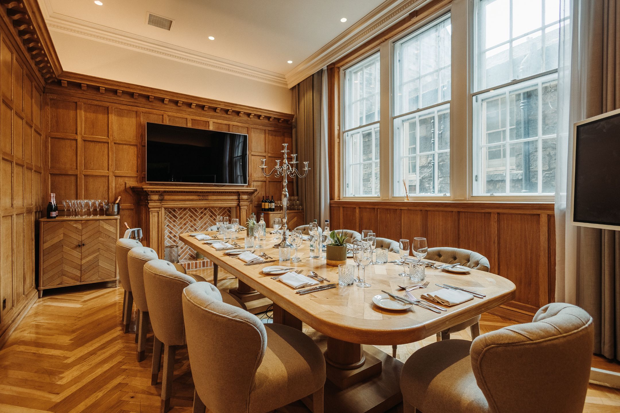 The Dalmore boardroom at Scotsman Hotel, wood-paneled venue for executive meetings and events. - Banner