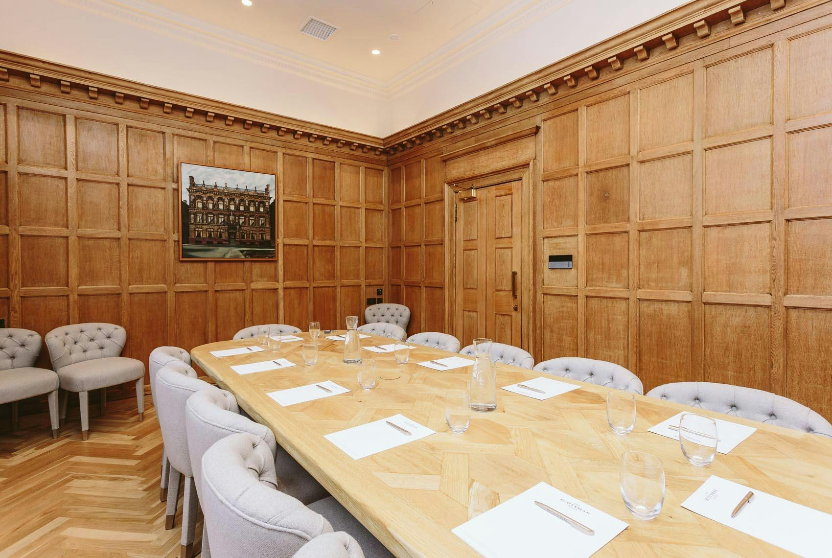 Sophisticated Boardroom at Scotsman Hotel, elegant wood paneling, ideal for meetings.