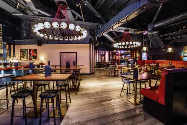 Modern event space at Puttshack Bank with stylish lighting for corporate and social events.