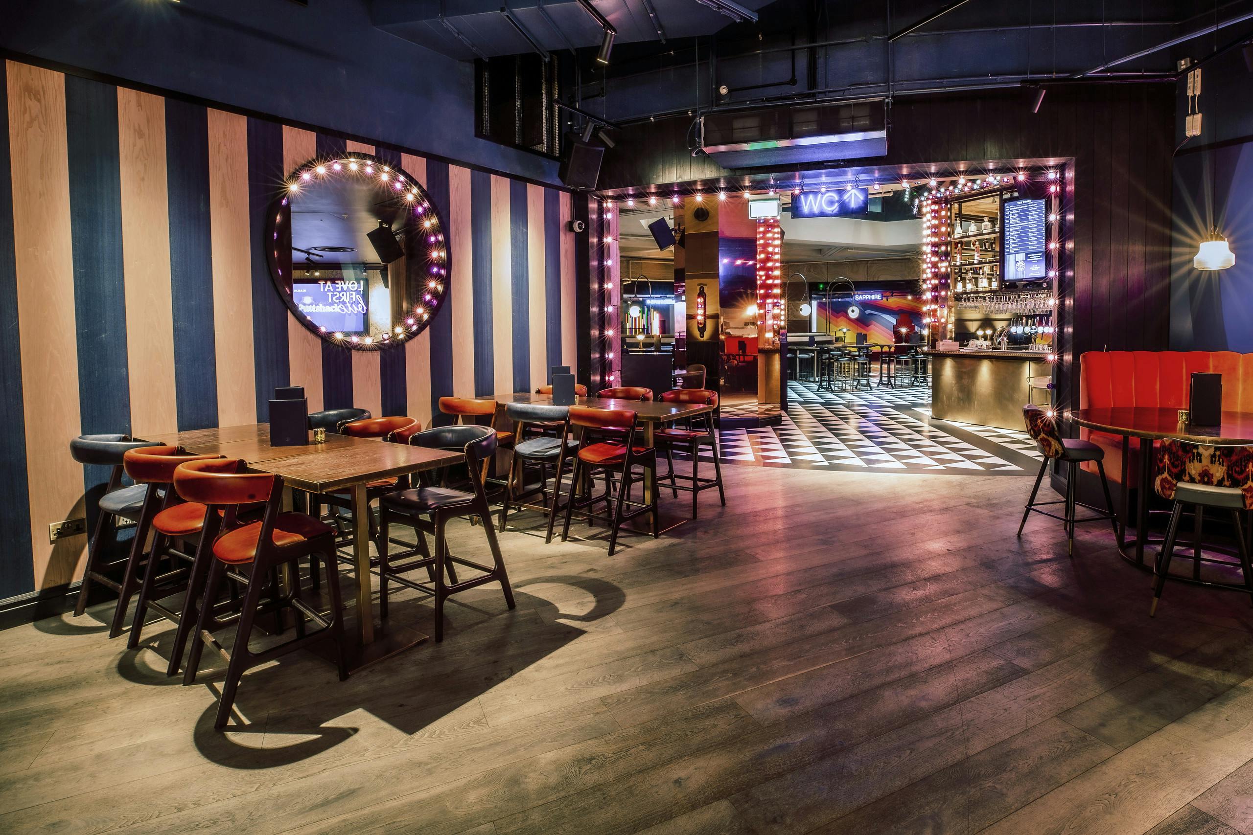 Half Venue Hire at Puttshack Bank, modern decor for networking and social events.