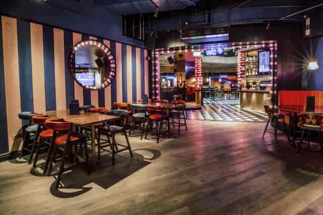 Half Venue Hire at Puttshack Bank, modern decor for networking and social events.
