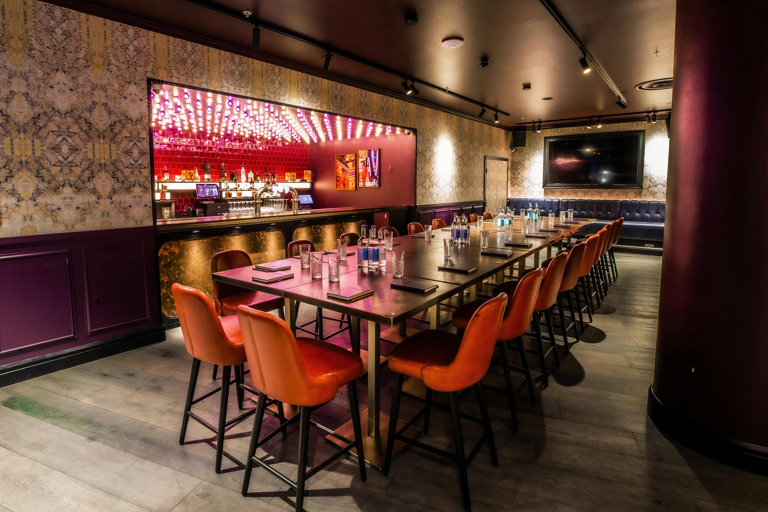 Ruby Private Room at Puttshack Bank, modern meeting space for corporate events and gatherings.