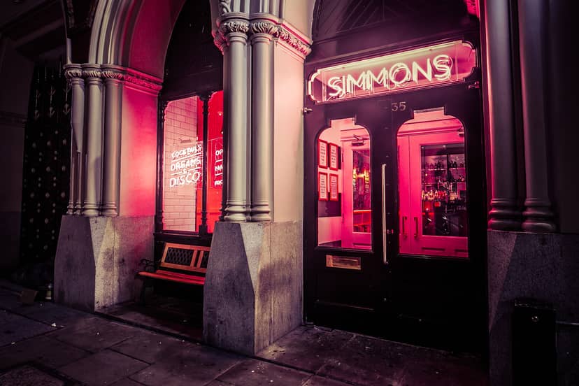Vibrant venue entrance with neon signage, perfect for events and gatherings.