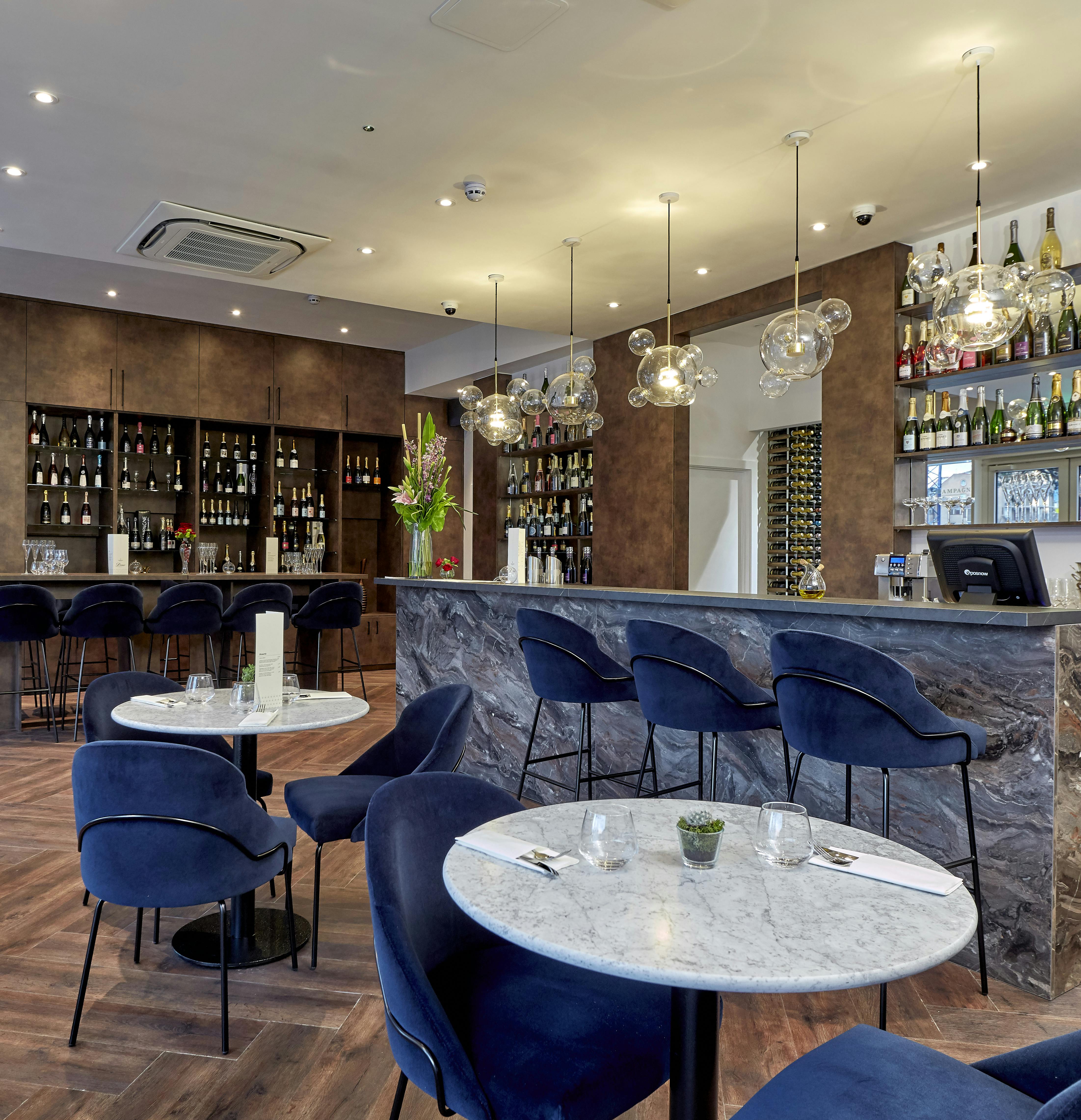 Stylish bar area in Champagne Route for intimate meetings and networking events.