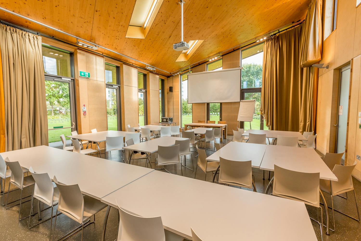Versatile Timber Lodge event space with natural light, ideal for meetings and workshops.