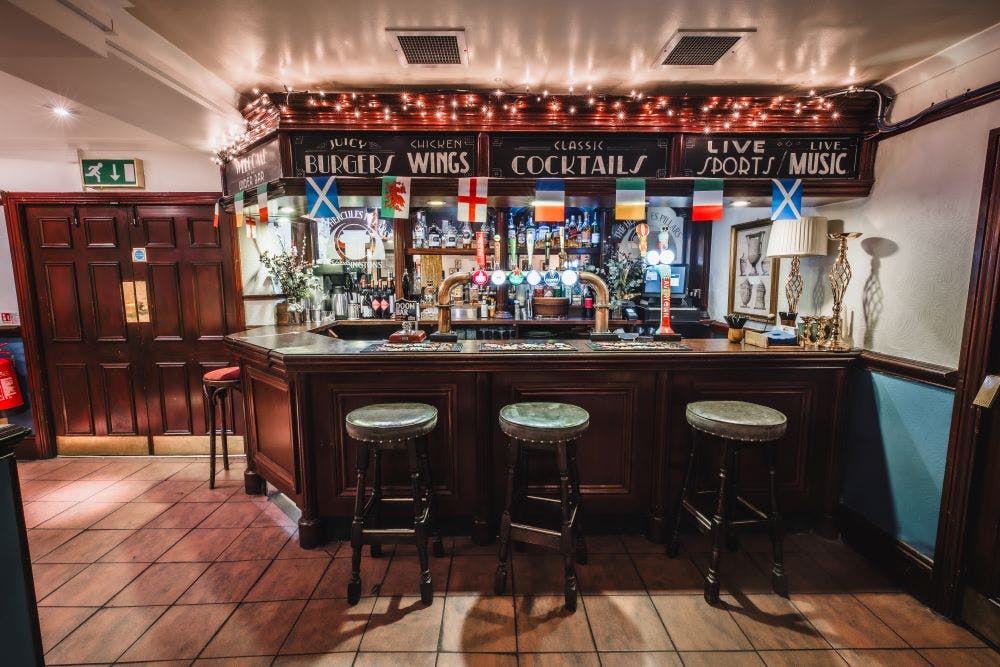 Cozy private function room at The Hercules Pillars for networking and casual events.