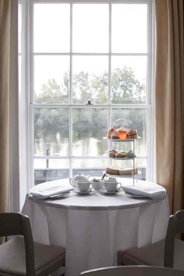 Elegant afternoon tea setup in Commodores Room, Linden House for networking events.