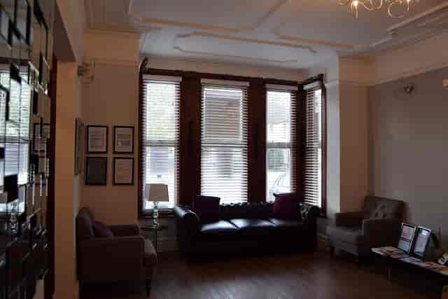 Consultation Room 1 at Best Health Clinics, featuring cozy seating for meetings and events.