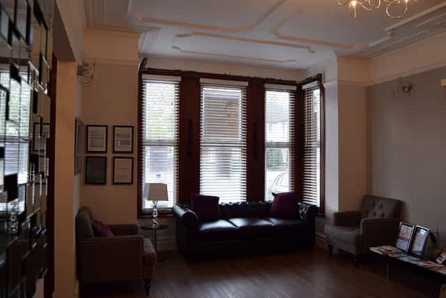 Consultation Room 1 at Best Health Clinics, featuring cozy seating for meetings and events.