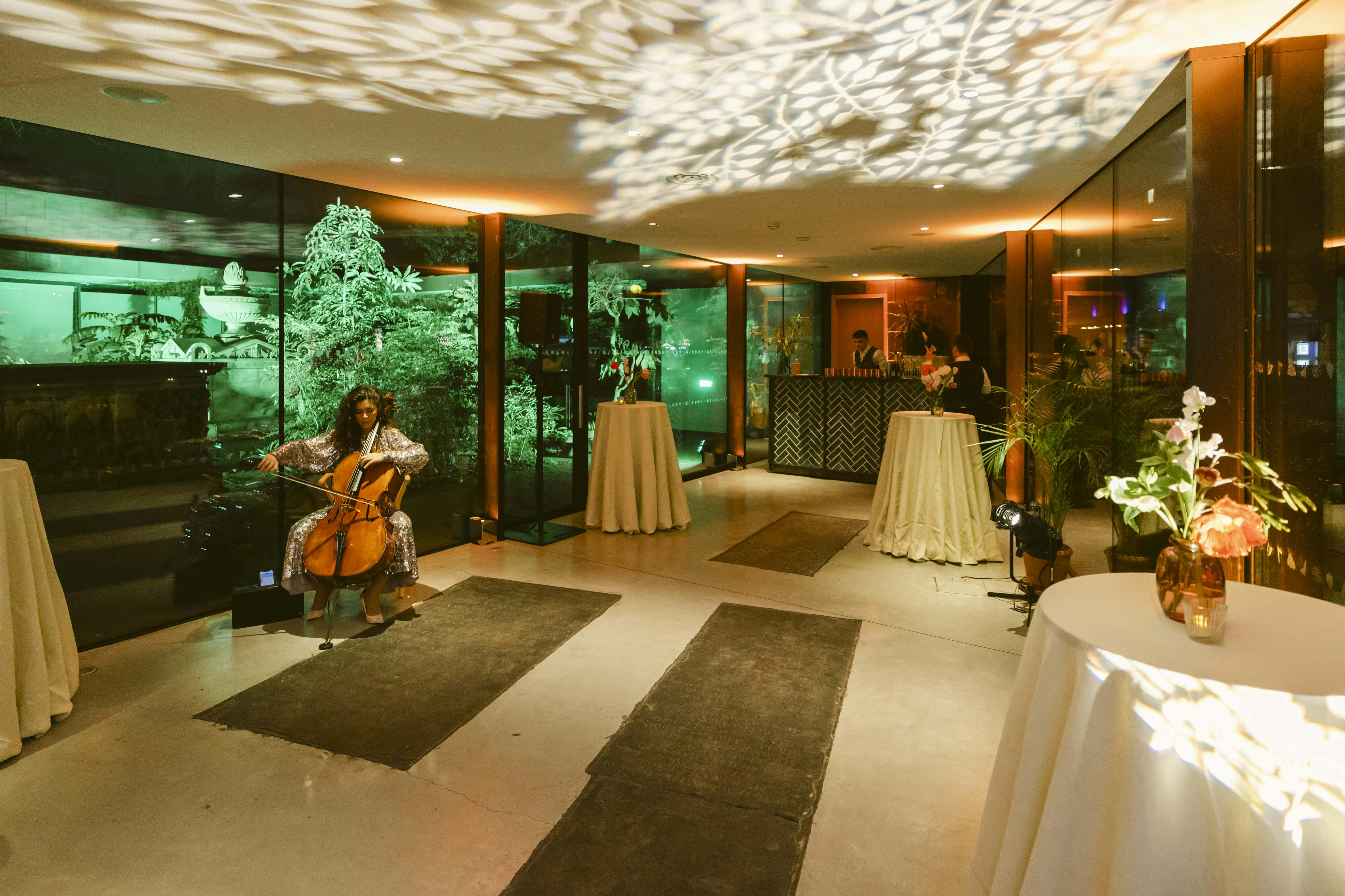 Elegant event space with floral tables, perfect for networking and cocktail receptions.