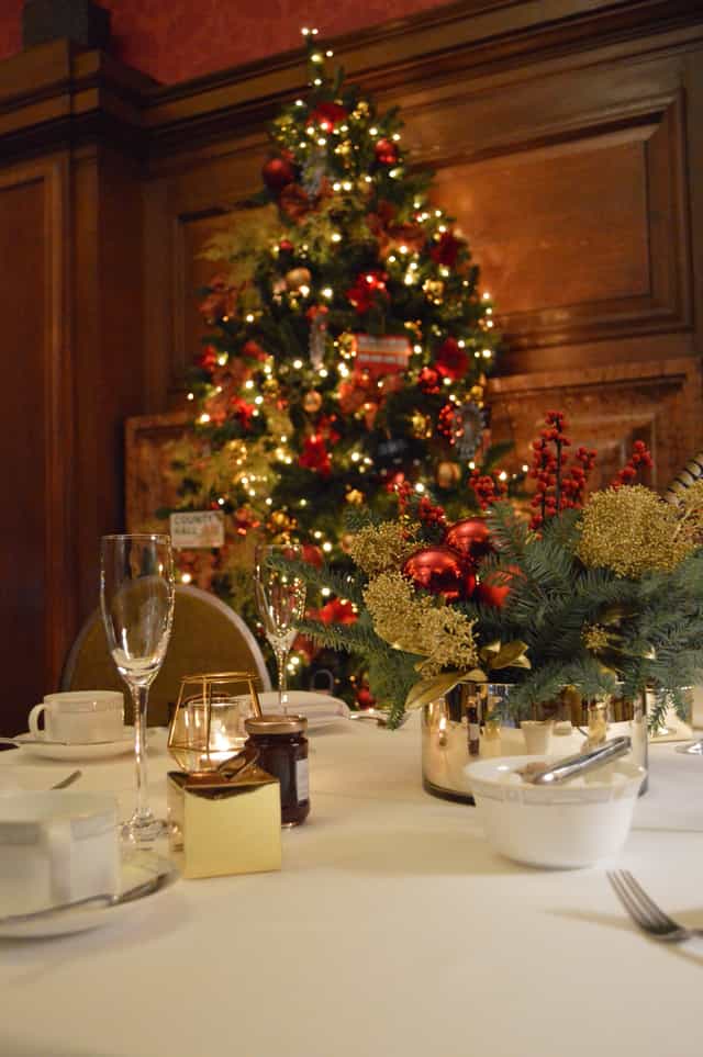 Elegant Christmas party table at London Marriott with festive decor and warm ambiance.