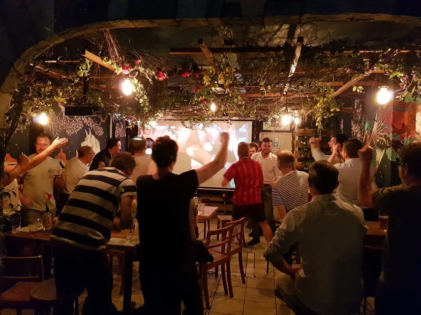 Lively BATCH Cocktail Bar event with engaged audience and warm lighting ambiance.