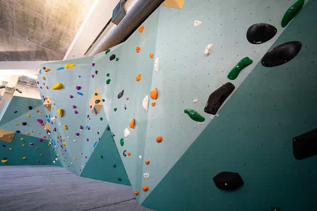 Vibrant indoor climbing wall for team-building events and active workshops.