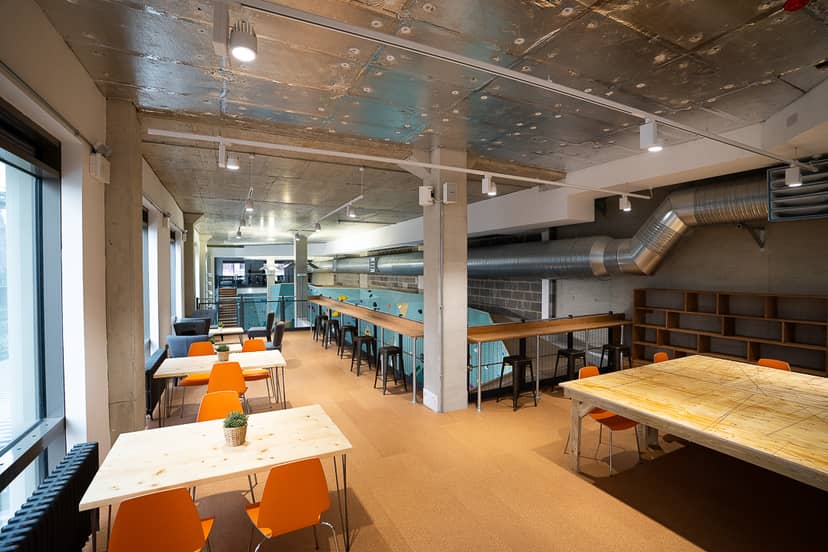 Versatile event space with flexible seating for workshops and networking at The Nest Climbing.