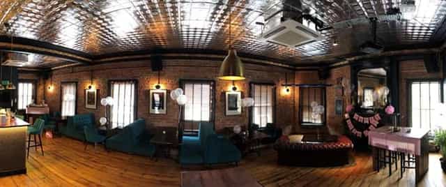 Charming event space with exposed brick walls for gatherings and celebrations.