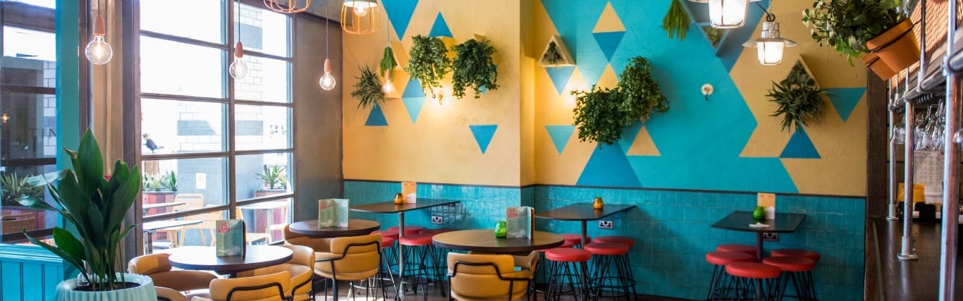 Vibrant event space at Las Iguanas Basingstoke with colorful decor for networking events.