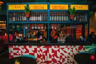 Vibrant bar area at Las Iguanas Bath, perfect for networking events and cocktail receptions.