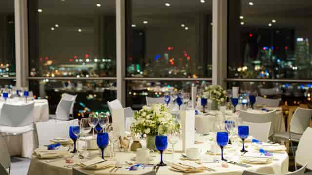 Banquet at 90 Bar & Kitchen Hackney Wick with cobalt glassware, ideal for corporate event venues.