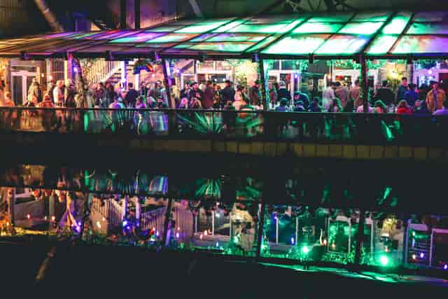 Vibrant event space at 90 Bar & Kitchen with colorful lighting for networking gatherings.
