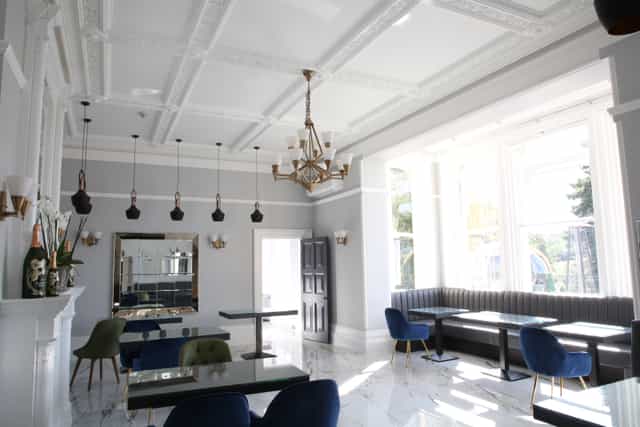 Hilltop Lounge at Ponsbourne Park Hotel, elegant event space with chandelier, corporate gatherings.