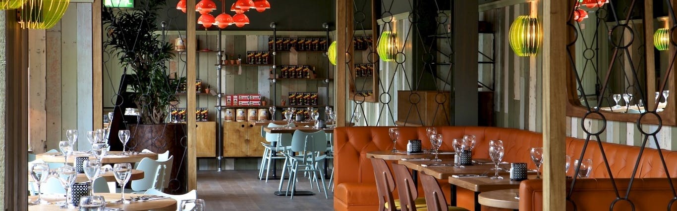 Stylish dining space at Las Iguanas Cambridge, ideal for networking events and gatherings.