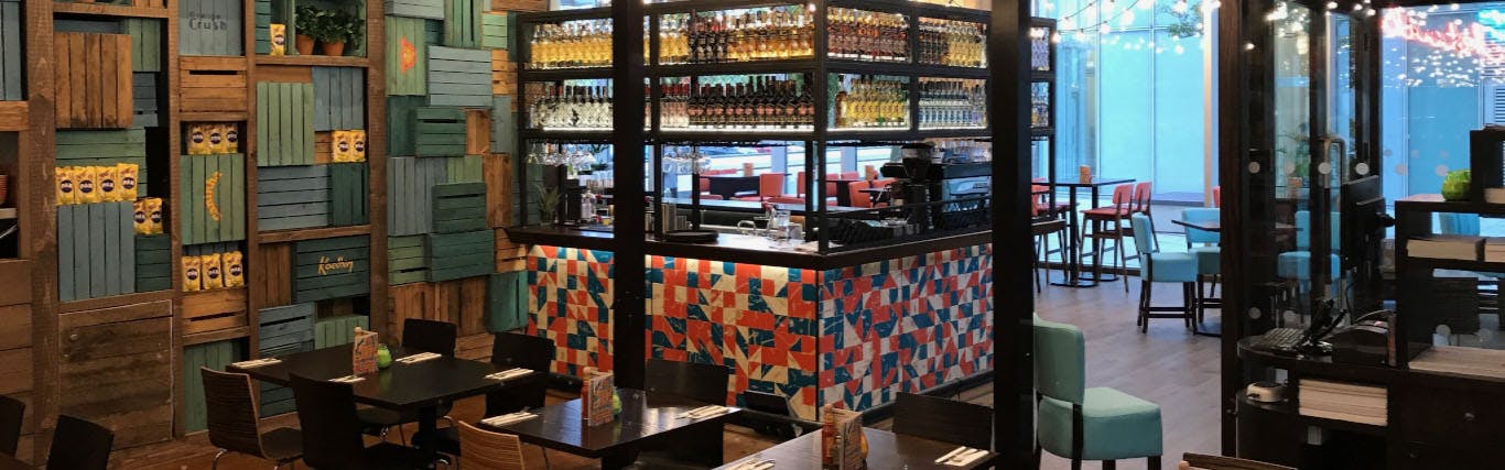 Vibrant bar area in Las Iguanas Milton Keynes, perfect for networking events and gatherings.