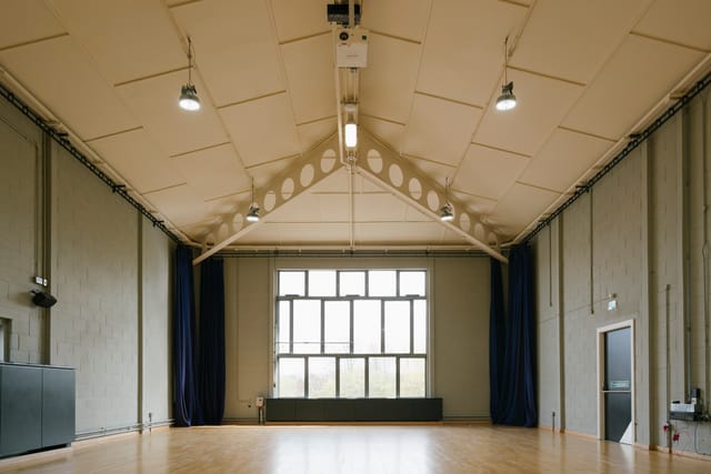 Spacious, well-lit event space with high ceilings at Contact Theatre for meetings and workshops.