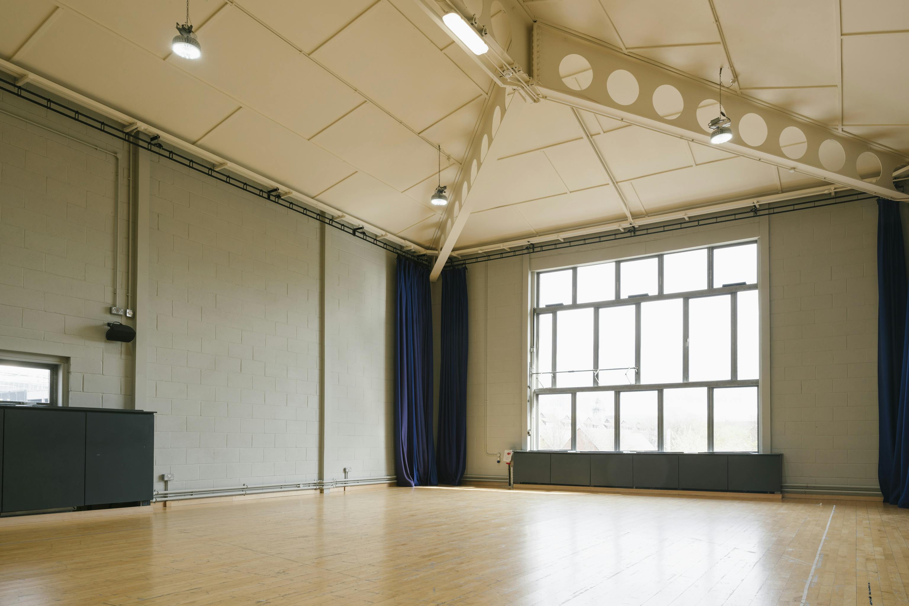 Spacious, well-lit event space with high ceilings for meetings and workshops at Contact Theatre.