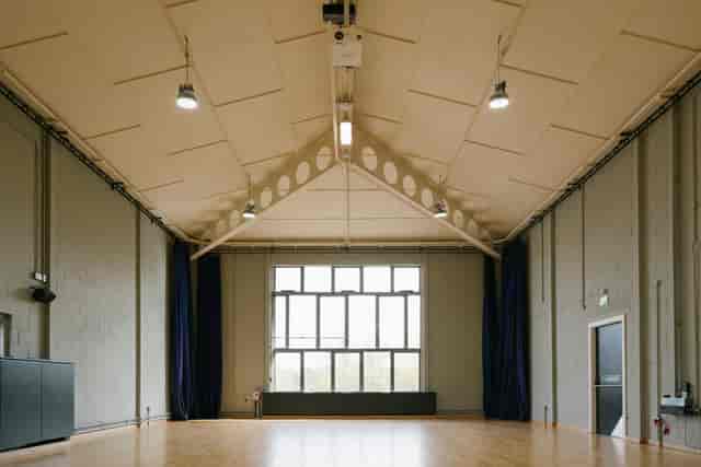 Spacious event space with high ceilings at Contact Theatre, perfect for meetings and workshops.