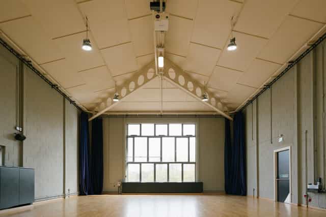 Spacious event space with high ceilings at Contact Theatre, perfect for meetings and workshops.