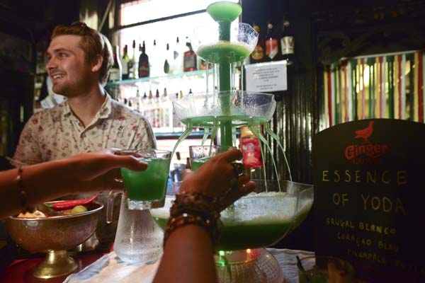 Vibrant bar setup with multi-tiered drink fountain for themed events at Hotel Pelirocco. - Banner