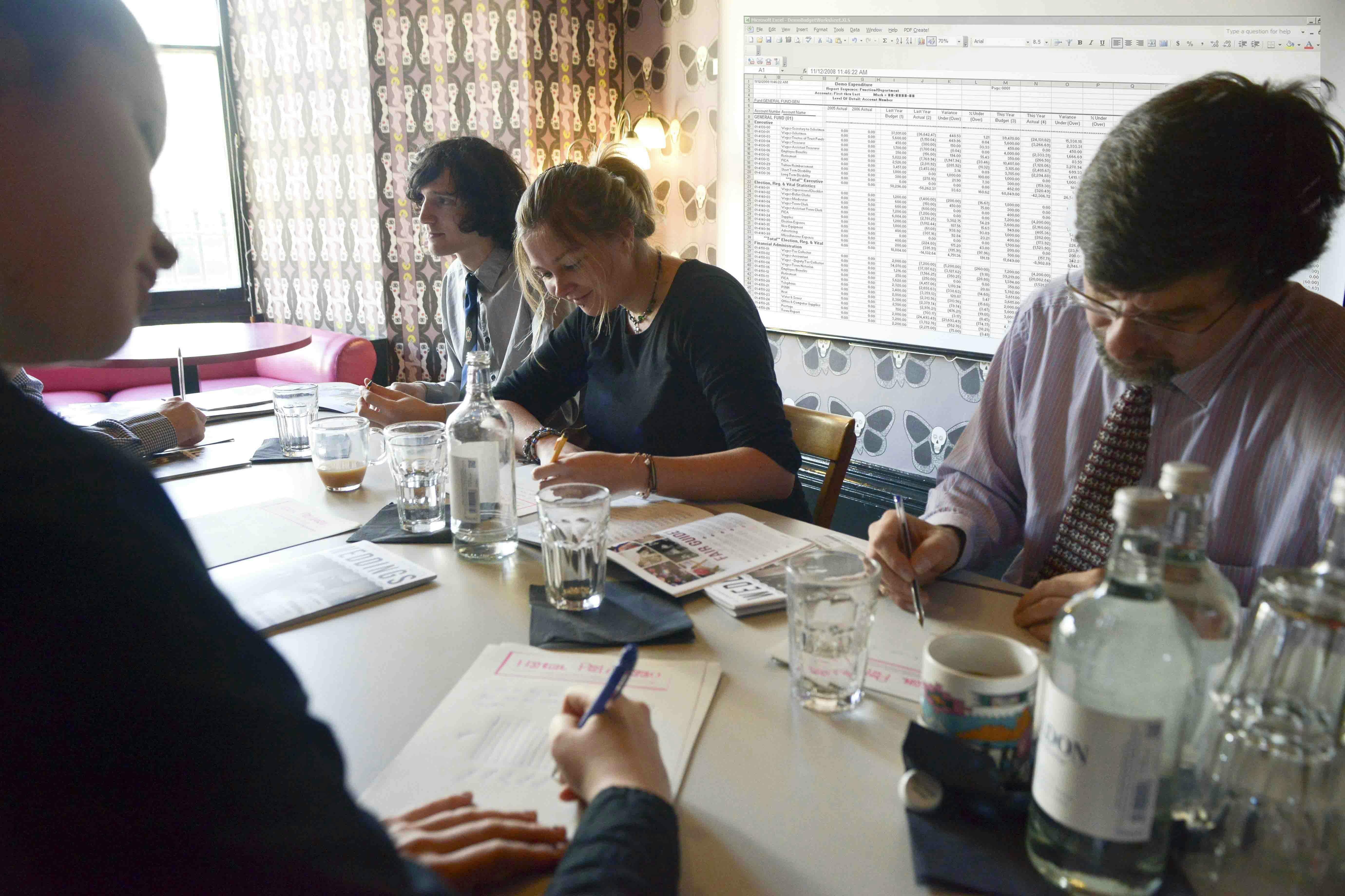 Meeting room at Hotel Pelirocco with professionals engaged in a productive discussion.