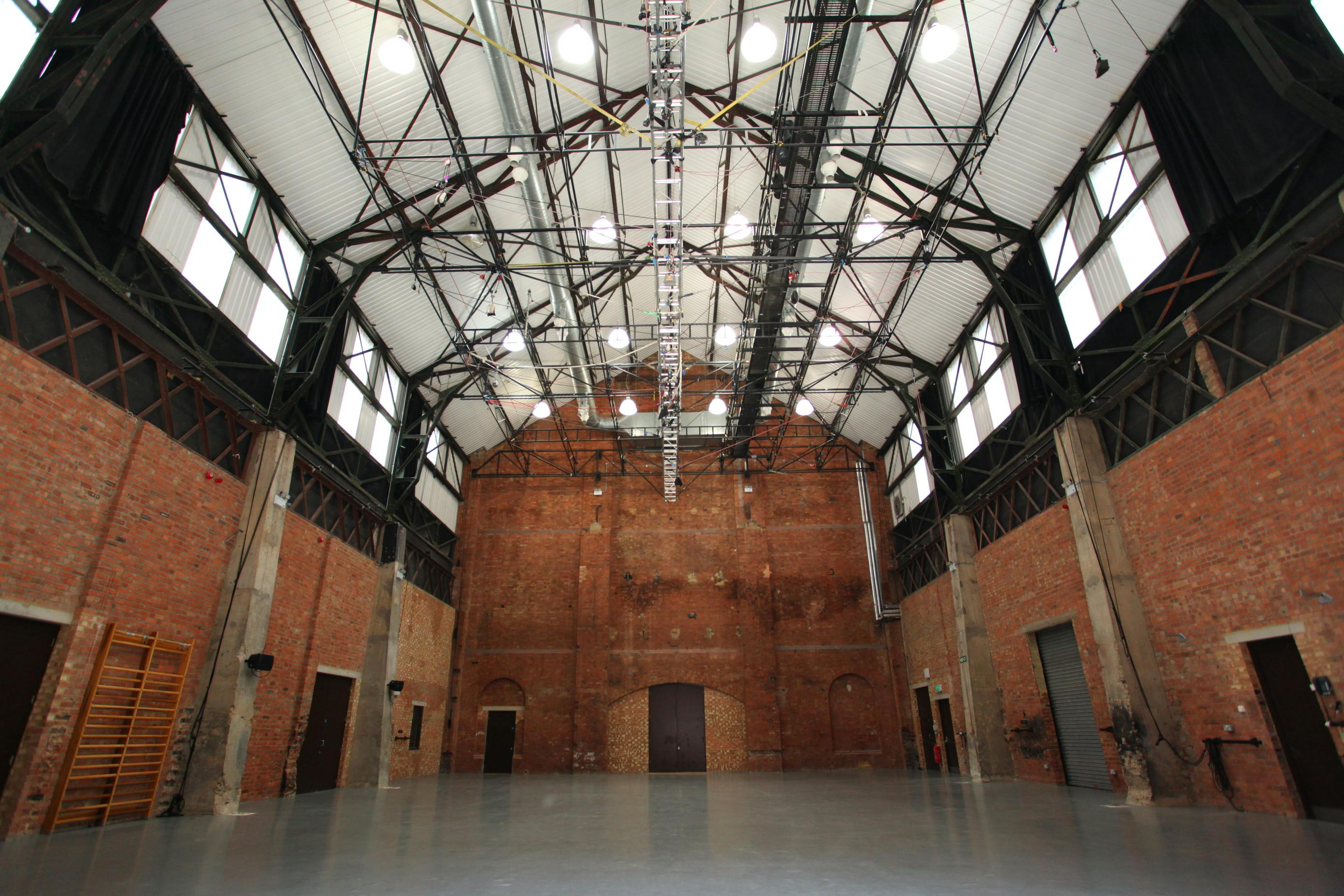 Spacious industrial event venue with high ceilings in Shoreditch Electric, ideal for gatherings.