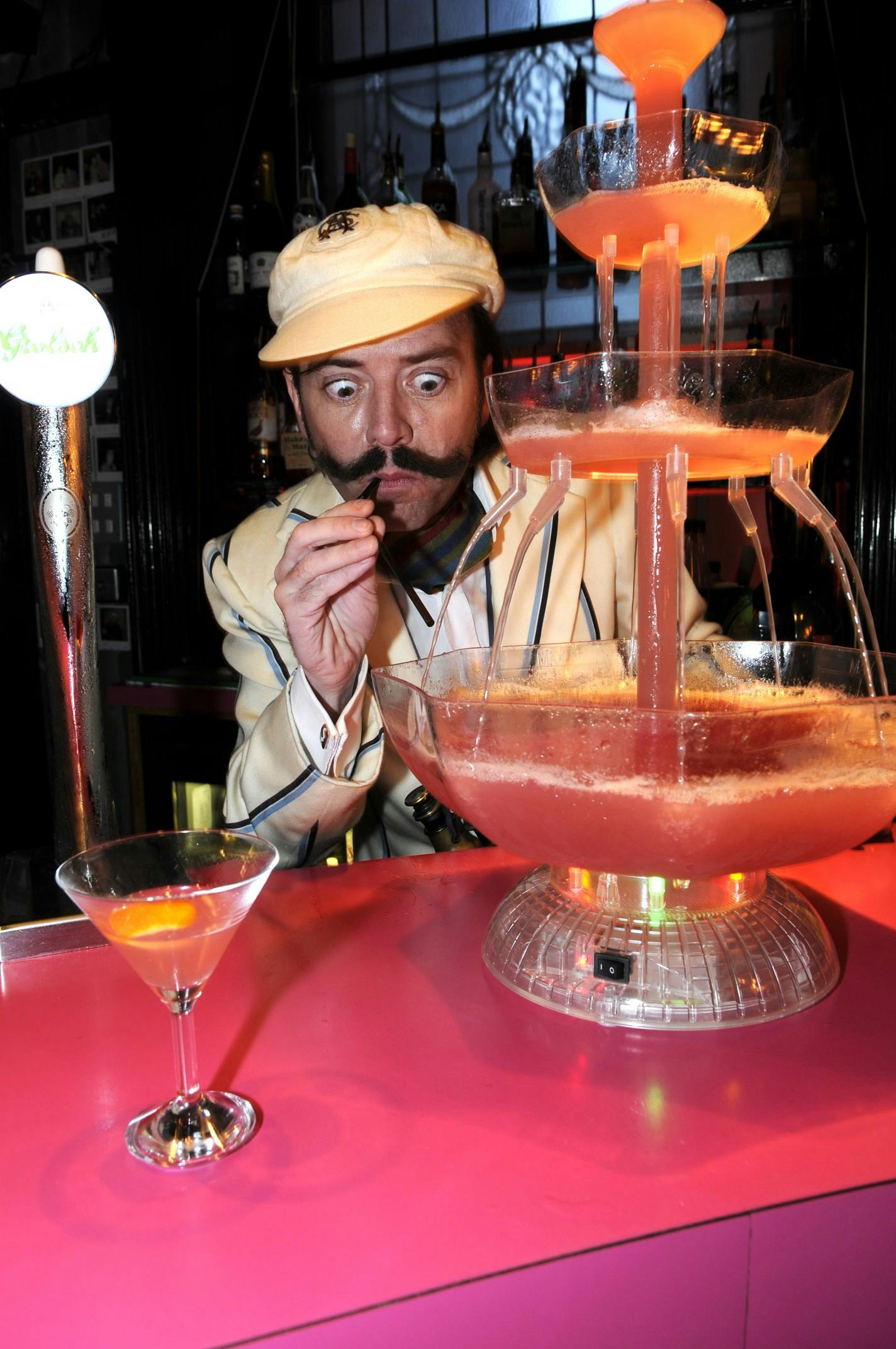 "Multi-tiered drink fountain at Hotel Pelirocco bar for themed parties and social gatherings."