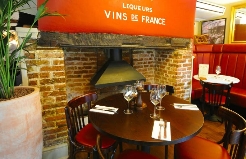 Cozy dining setup at Café Rouge Cambridge, ideal for intimate meetings and events.